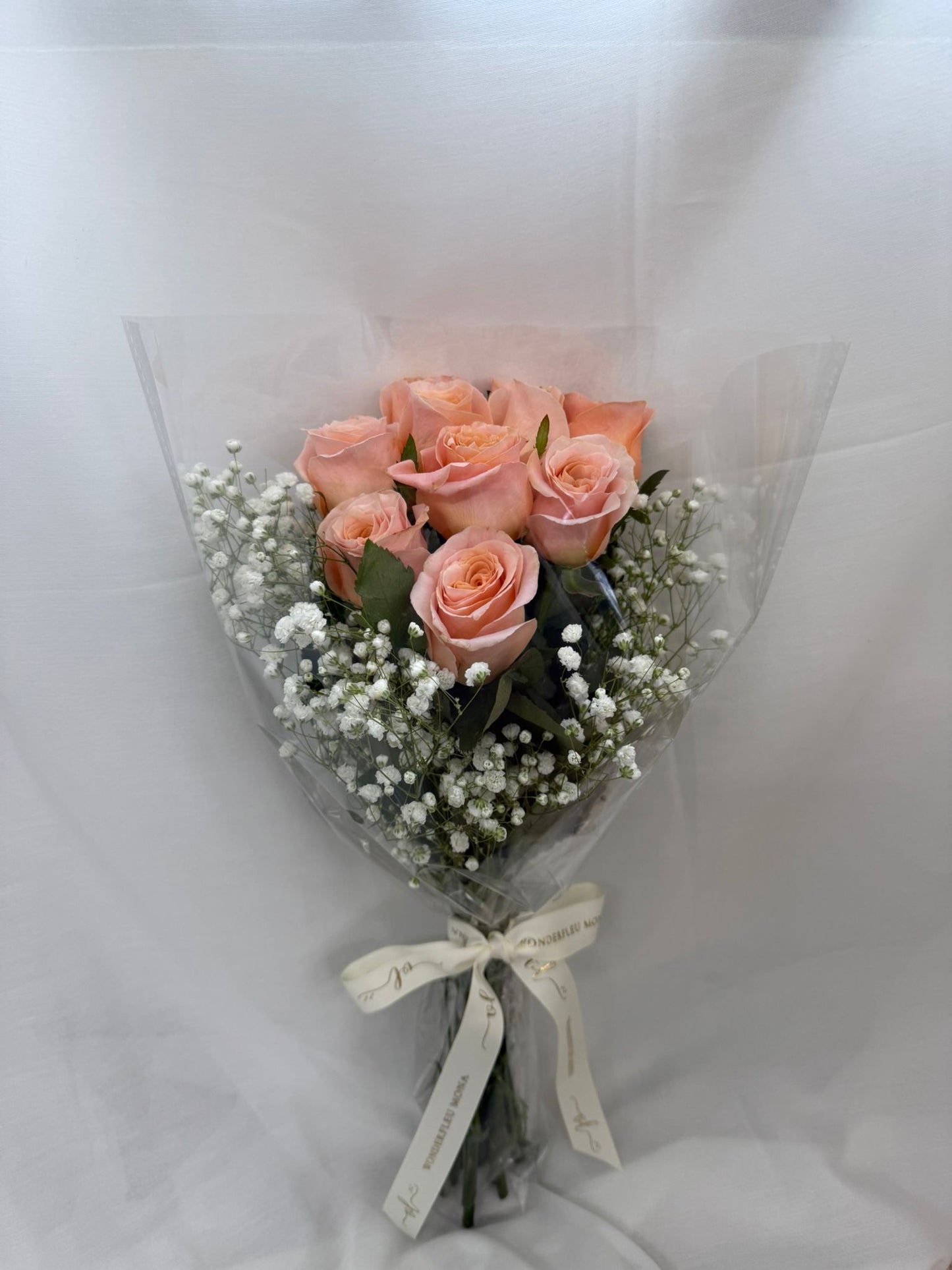 Packed Peach Roses With Baby Breath