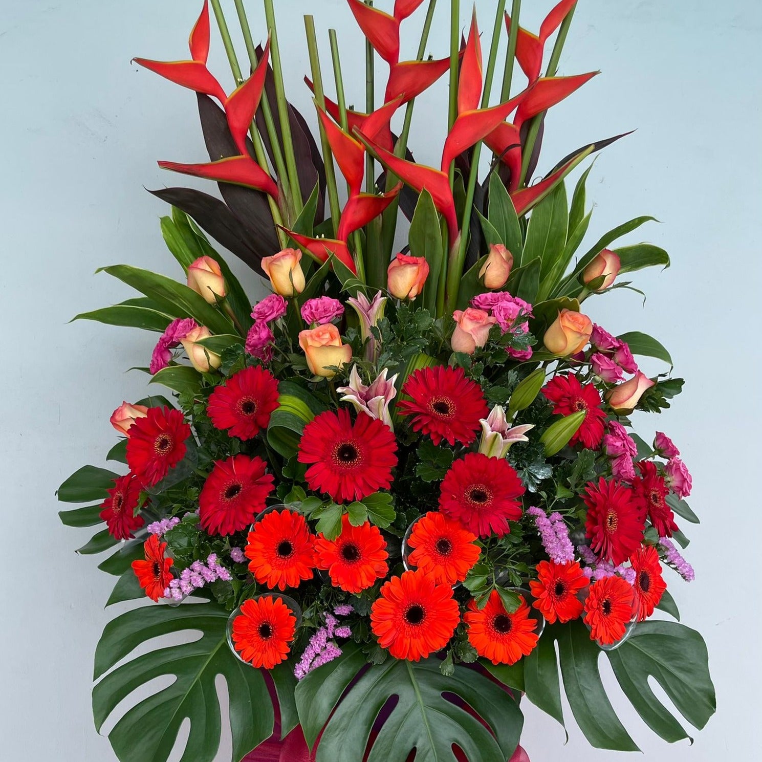 Cheap Fresh Heliconia, Roses, lilies and gerbera daises, static flower grand opening floral stand under $200 in Singapore Free Delivery
